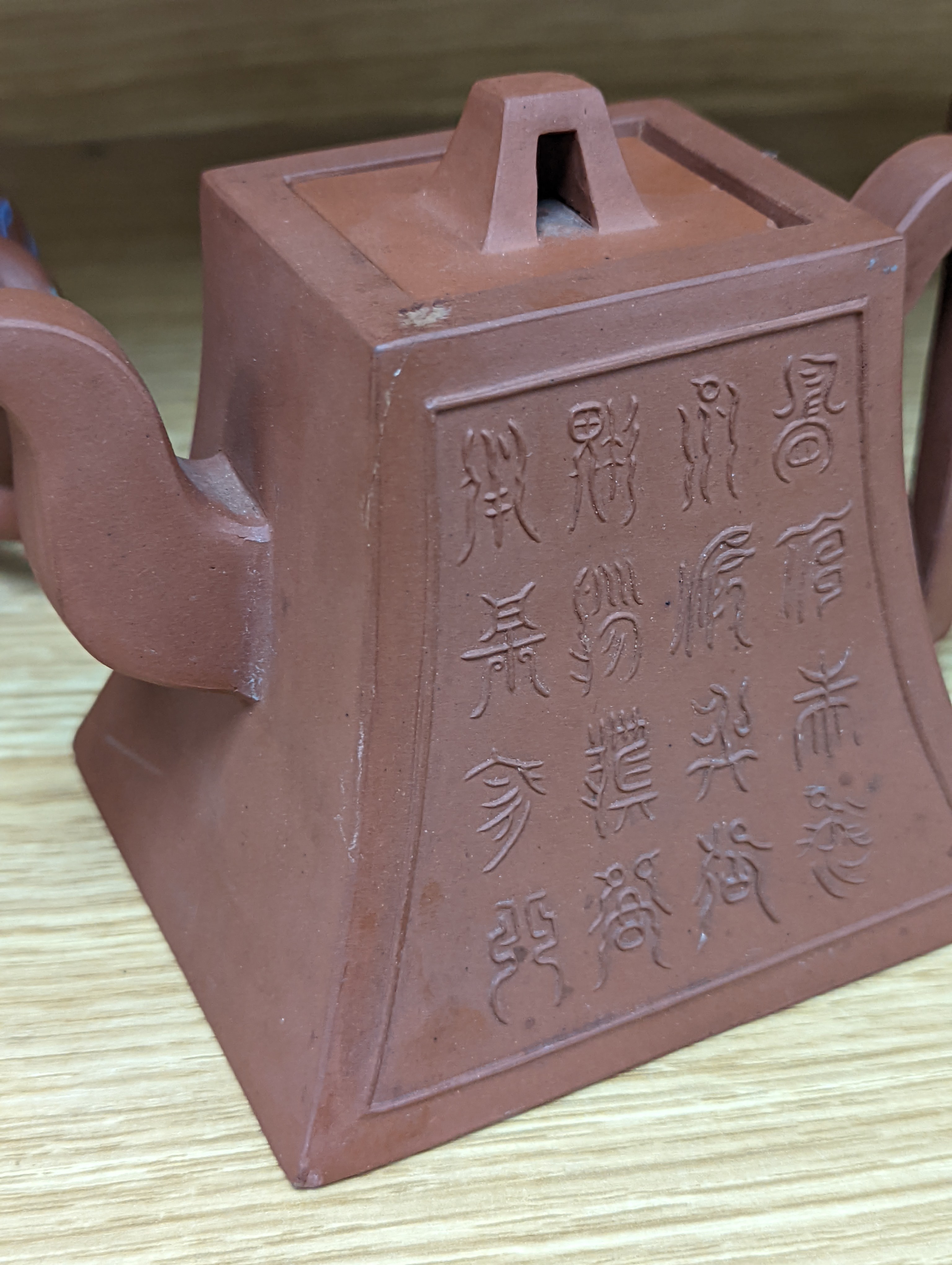 Three Chinese Yixing teapots and a carved soapstone teapot tallest 12cm